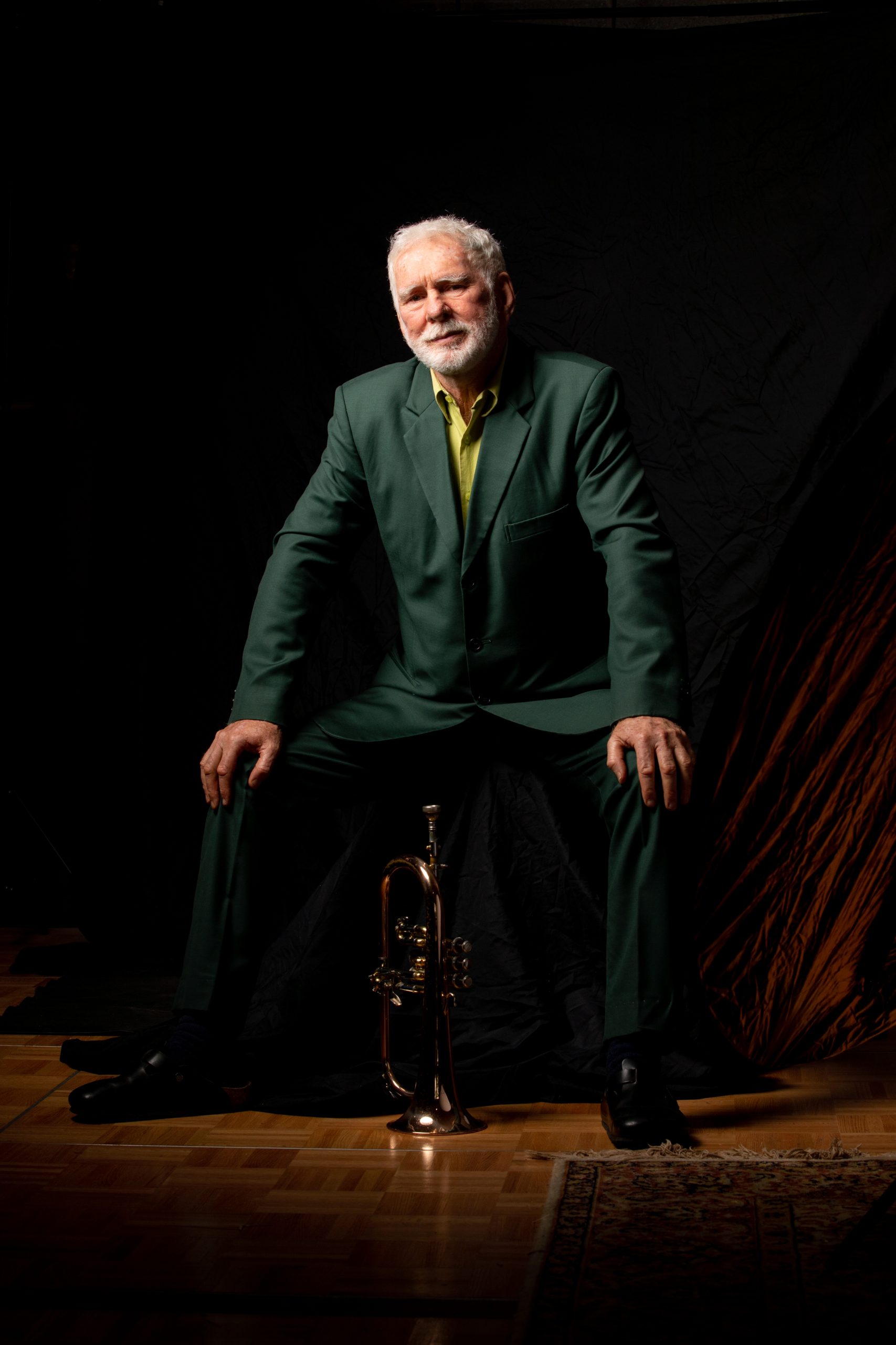Vince Jones sitting with trumpet shot by Creswick Collective HR